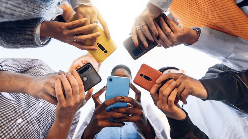 Teens using mobiles